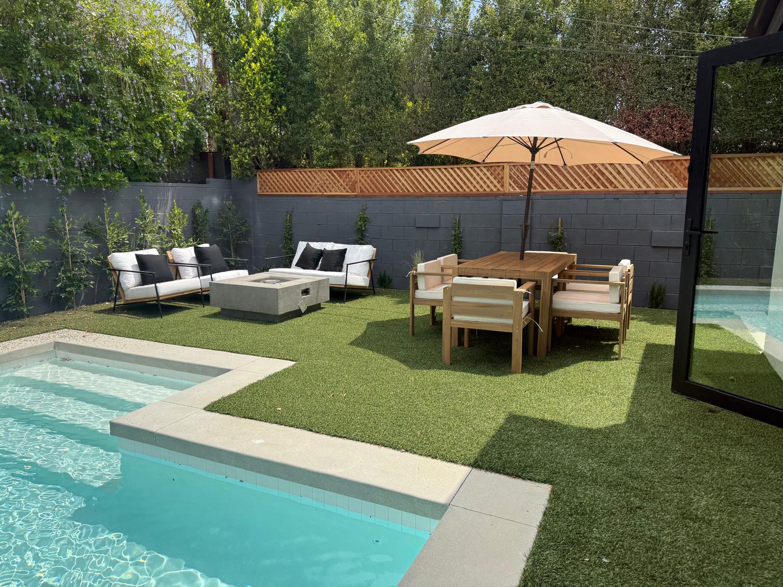 artificial grass installation Woodland Hills backyard at twilight
