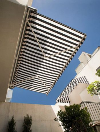 Retractable awning shading a villa terrace