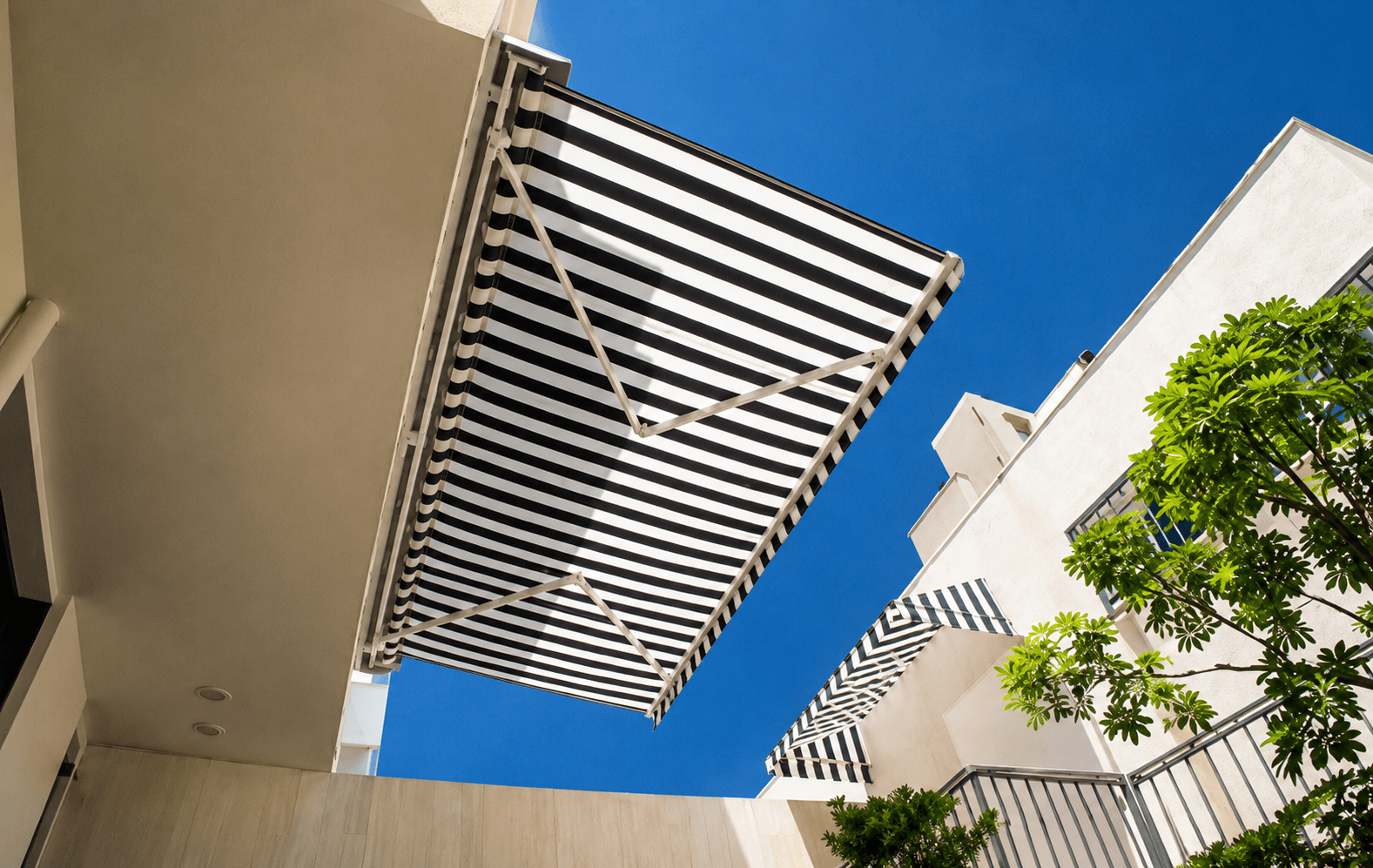 Retractable awning shading a villa terrace