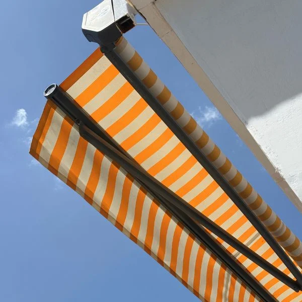 Retractable awning installed on a modern Dubai facade