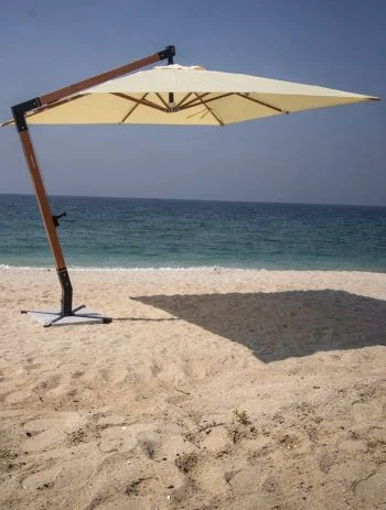 Central-pole outdoor umbrella on a Dubai beachfront