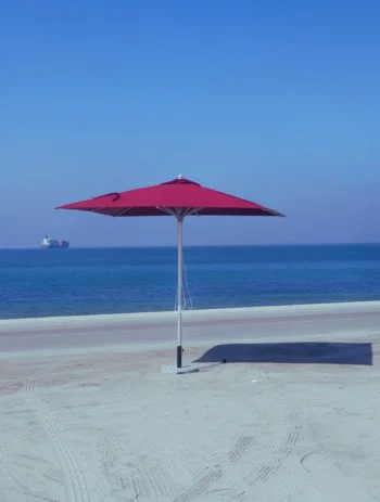 Cantilever outdoor umbrella on a beachfront terrace