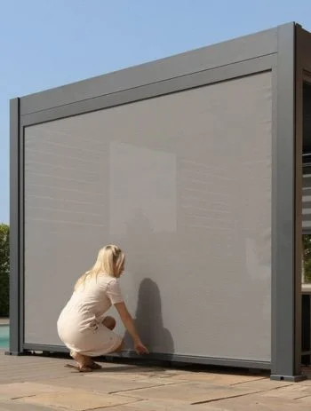 Zip screen blinds lowered on a pergola terrace