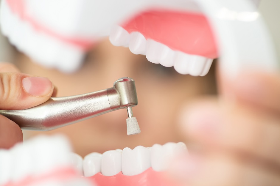 a reception in the dentist's office, cleaning the enamel of teeth